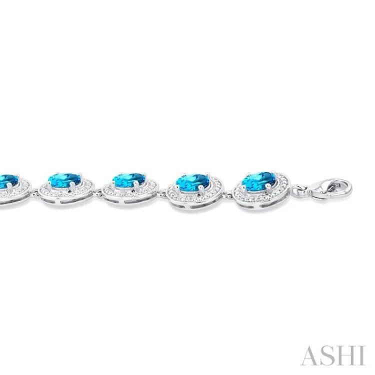 1/10 ctw Oval Shape 7X5 MM Blue Topaz and Round Cut Diamond Semi Precious Bracelet in Sterling Silver