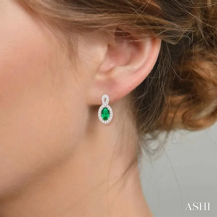 5x3 MM Oval Cut Emerald and 1/5 Ctw Round Cut Diamond Earrings in 10K White Gold